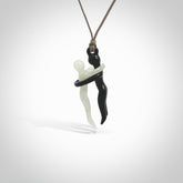 This small sized couples embrace pendant is made from Australian Black Jade and Jadeite Stone. We've hand carved this piece for all the lovers out there. Free postage worldwide. Black Jade and Jadeite Stone couple hugging jewellery. Provided with an adjustable mushroom coloured cord and packaged in a woven kete pouch.